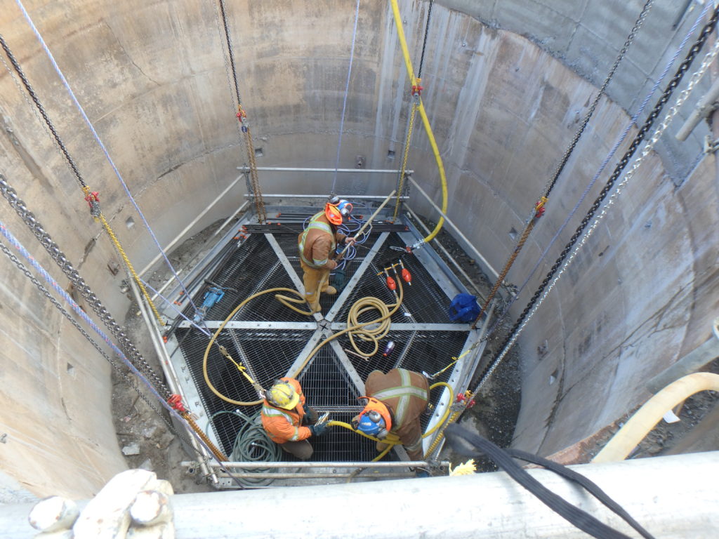 Copper Cliff South Mine 830 FAR Widening: From an existing Surface Level Raise Bore Hole, Legend widened the 14 foot diameter to 18 feet to accommodate ventilation requirements for South mine of the Copper Cliff Complex. At the 350ft mark, Legend also drove a lateral drift 32ft in length for future development opportunities.